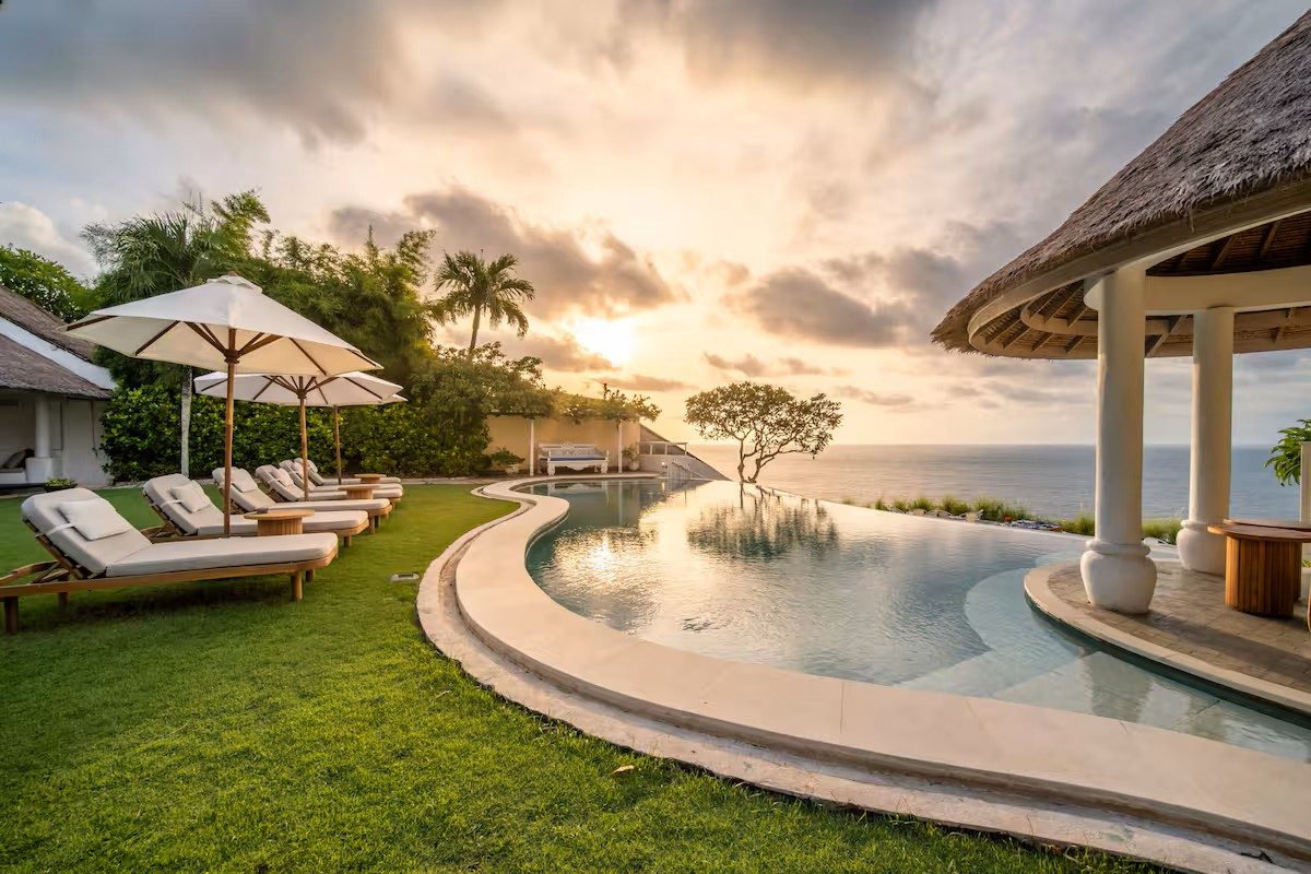 Infinity pool over the Bingin cliffs at golden hour, Uluwatu